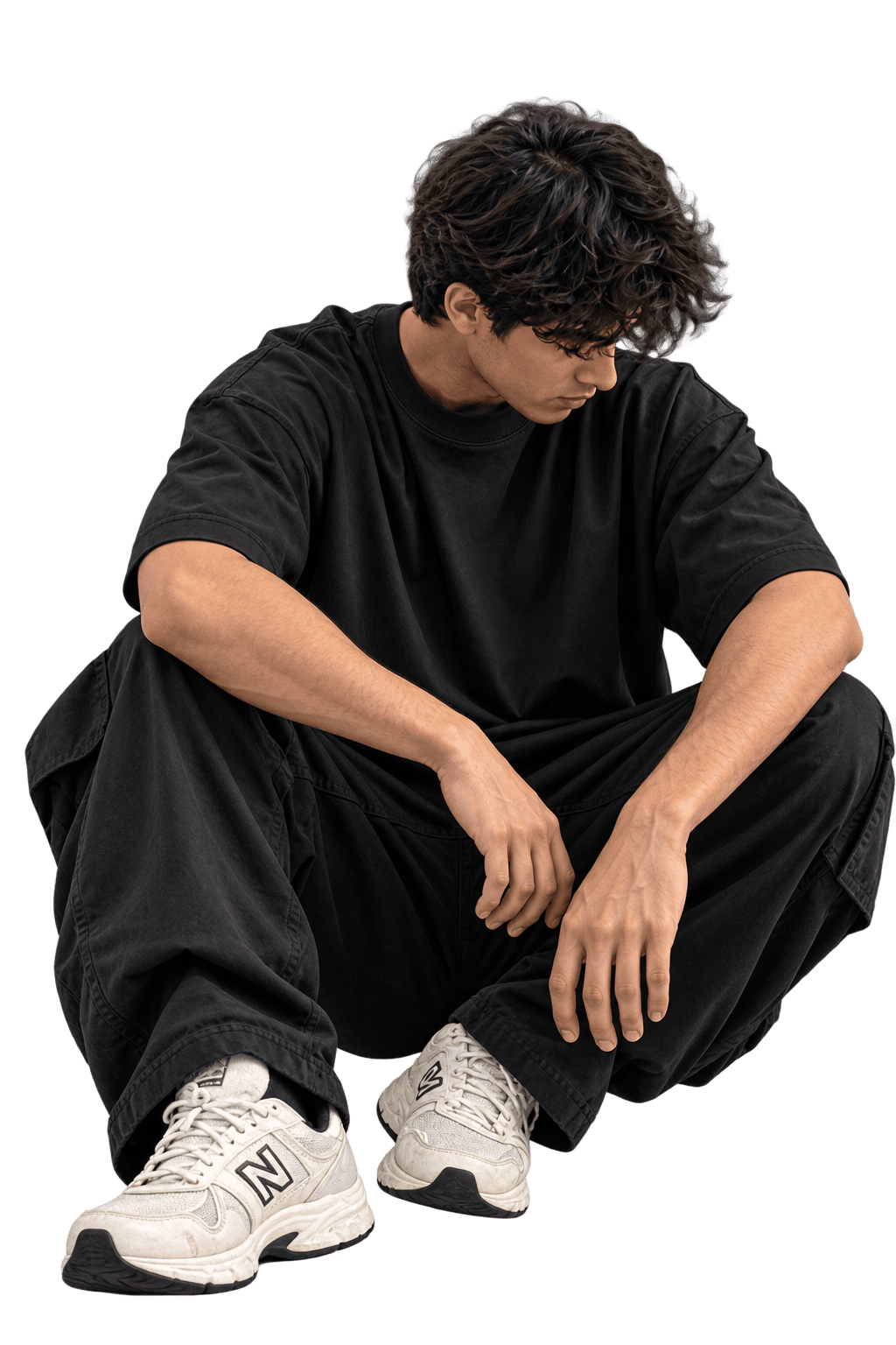 Model in an oversized black Voidthread tee, seated